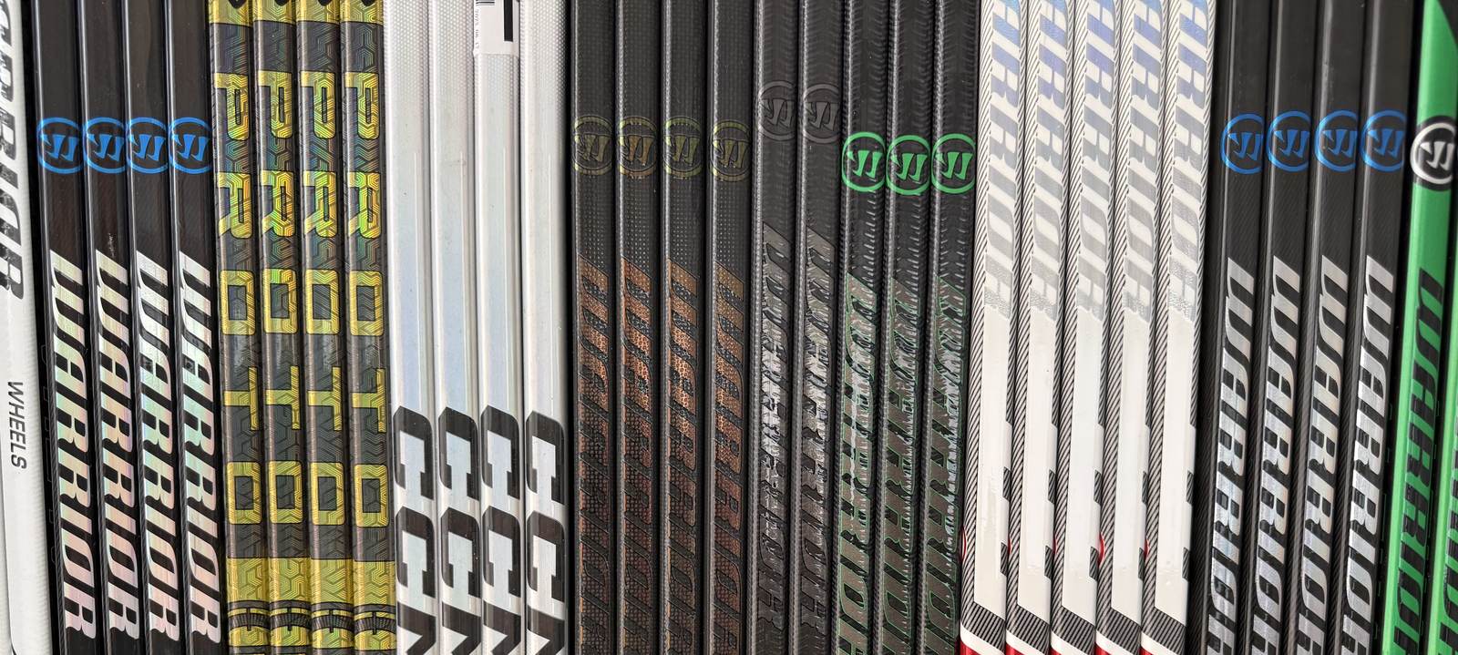 Wall of pro stock hockey sticks